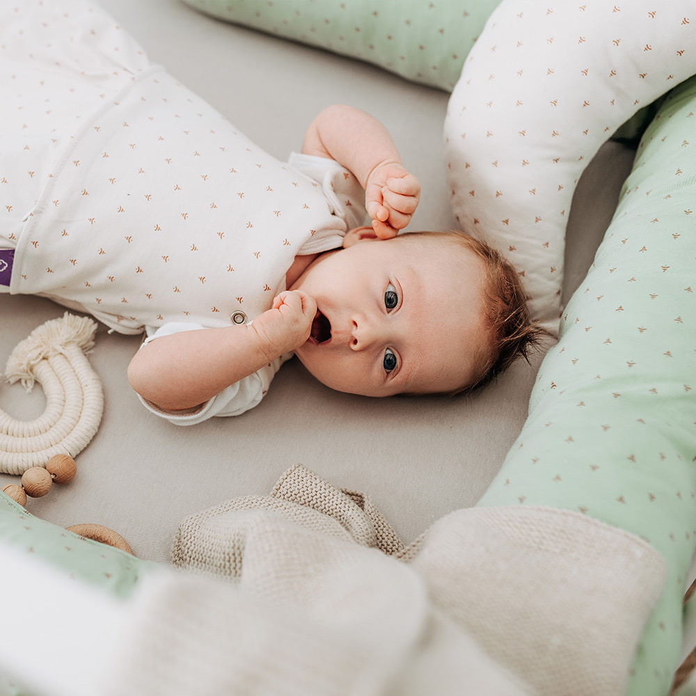 Baby with baby sleeping bag in Twister beige
