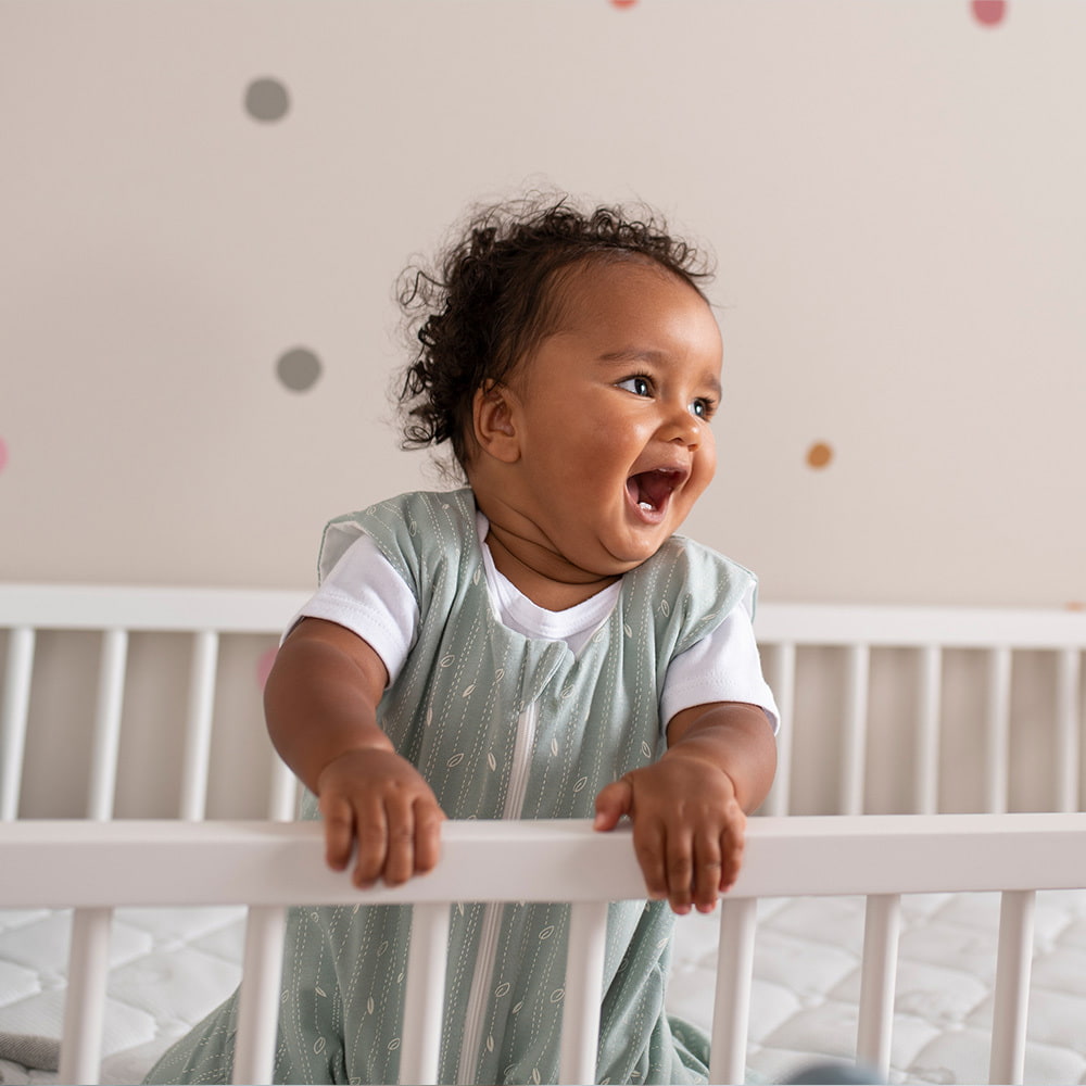 Baby in a GOTS-certified Träumeland sleeping bag