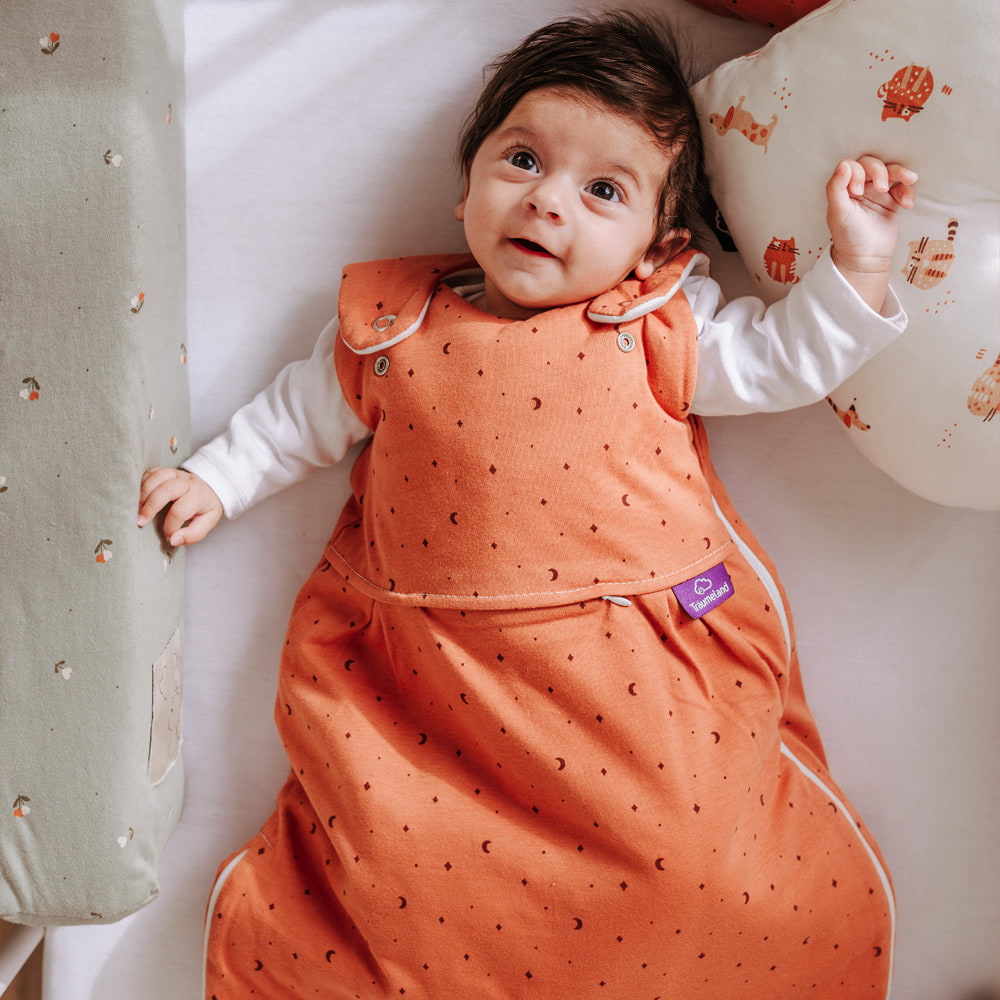 Lifestyle picture of a sleeping bag with baby