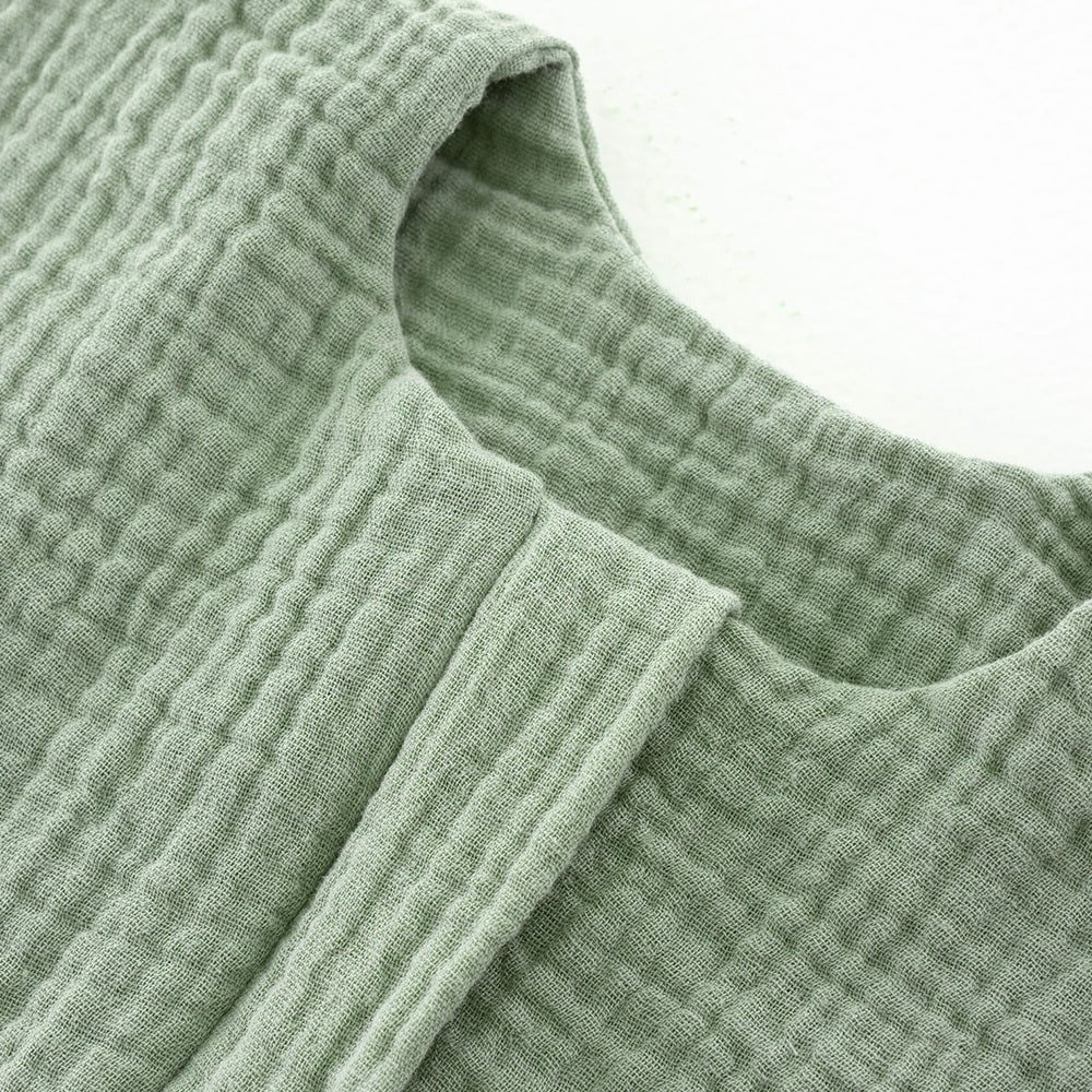 Musselin salbei grün Detail Kinnschutz