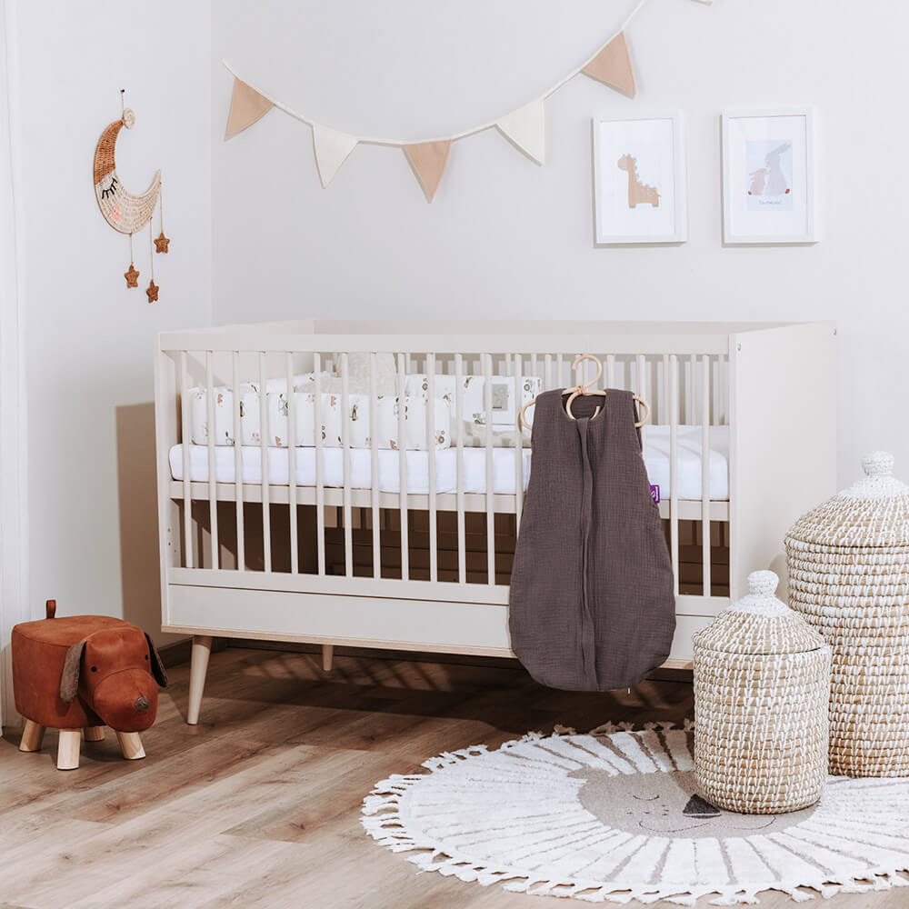Baby bedroom decorated in earthy tones