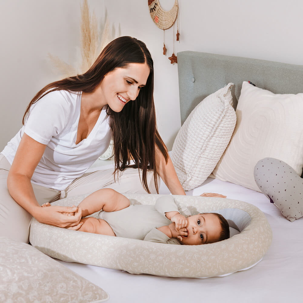 Baby in the nest with mom baby-in-baby-nest-with-mama