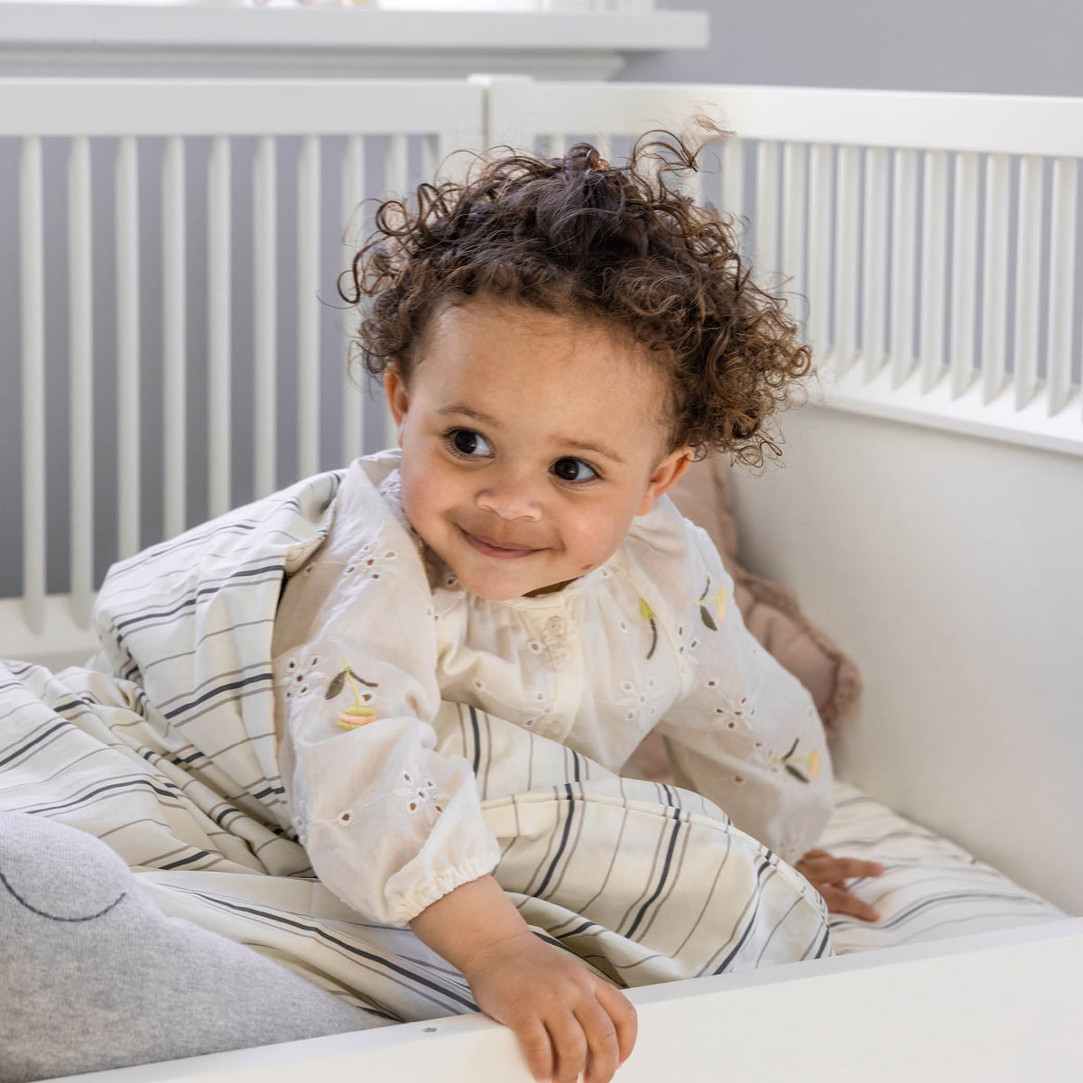 Happy child in a cot